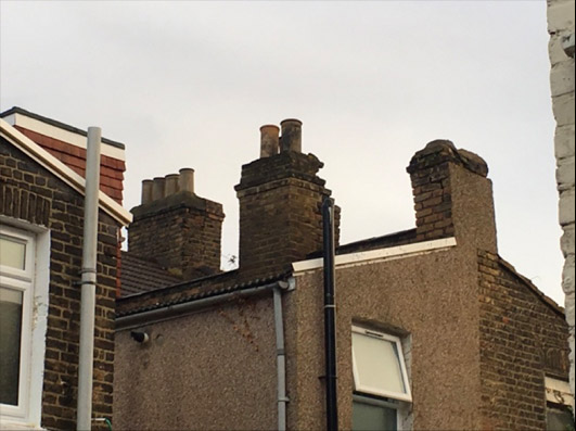 Severely Damaged and Leaning Chimney